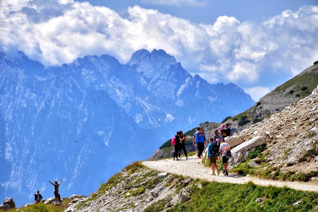 Family hiking on mountain trail
